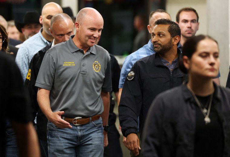 Utah Governor Spencer Cox, left, and FBI head Kash Patel speak