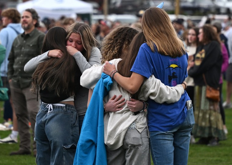 Members of nan Evergreen organization hugging