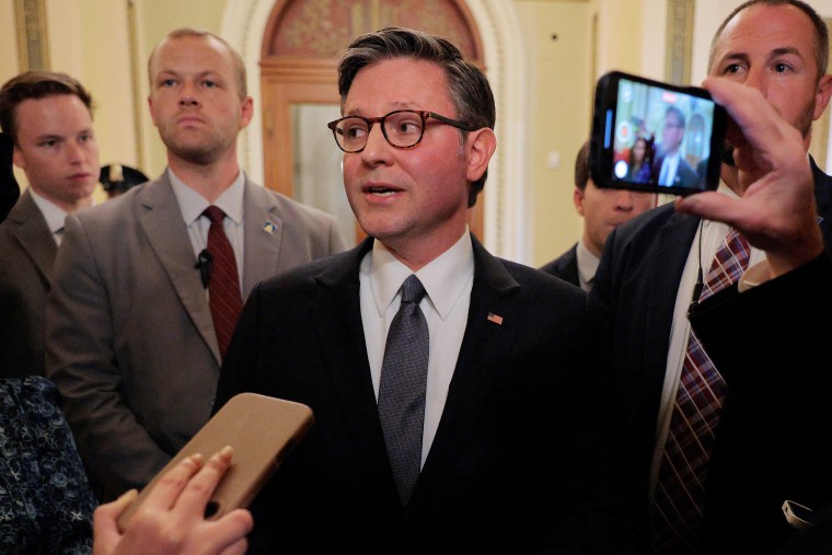Mike Johnson speaks with reporters.