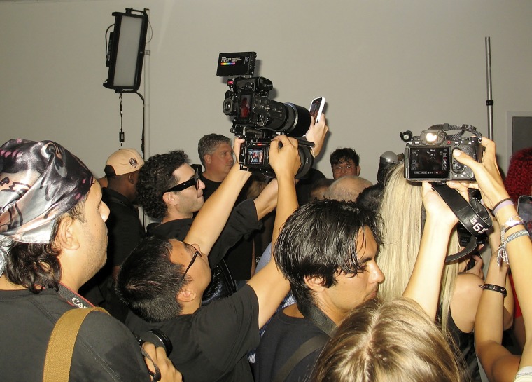 Photographers backstage at NYFW.