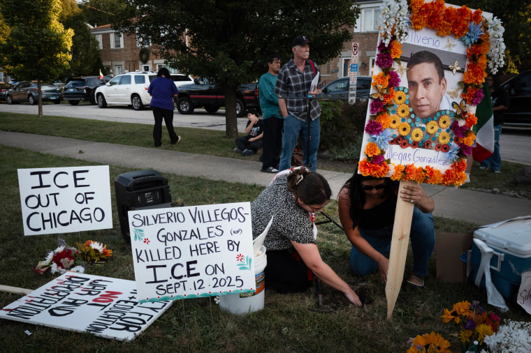 Anti-ICE signs outside at a memorial for Silverio Villegas Gonzalez