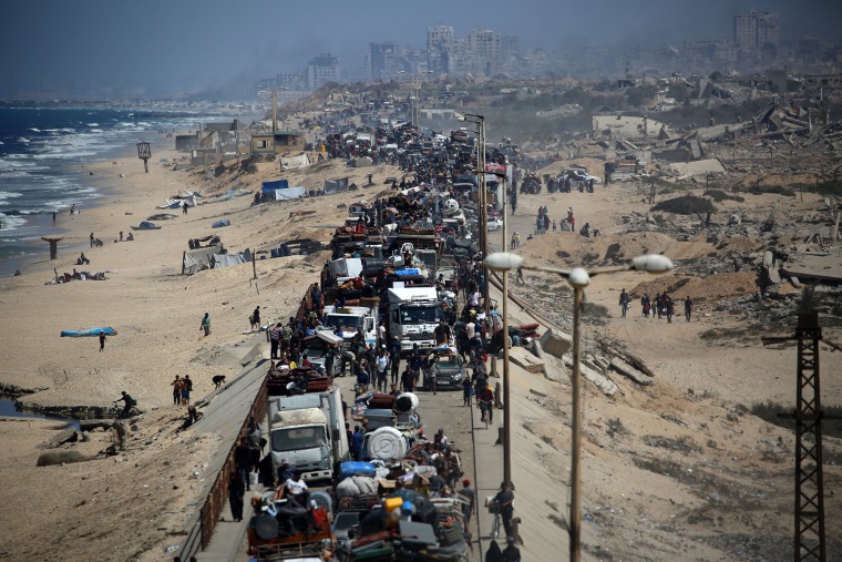 Palestinians from Gaza City move southwards with their belongings,
