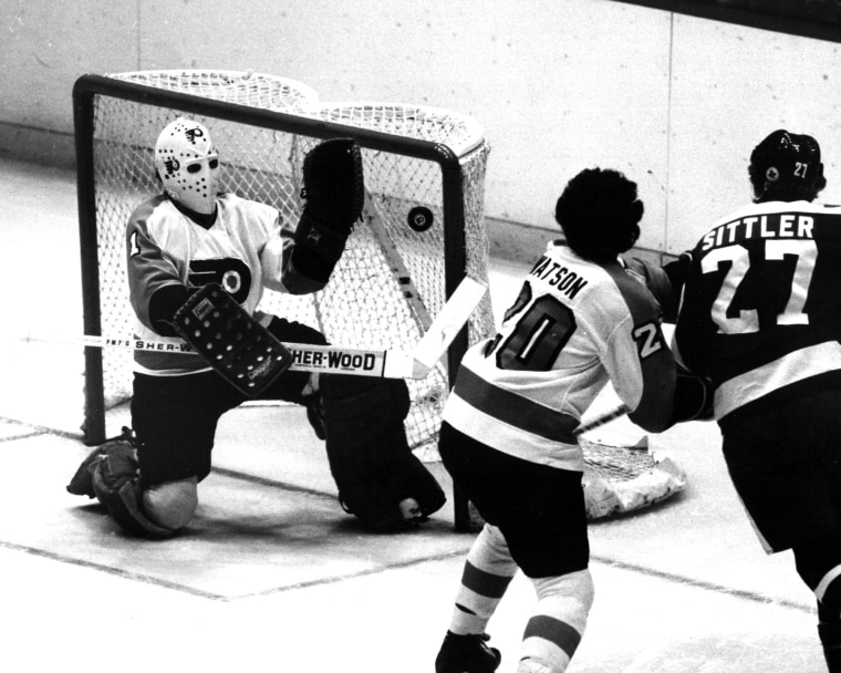 Bernie Parent makes a glove save at the goal net