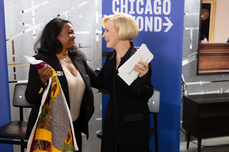 Tatyana Ali with a quilt in her hand, speaks to Mika Brzezinski.