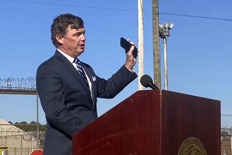 South Carolina Department of Corrections Director Bryan Stirling holds up a cell phone while discussing contraband cell phones outside of Broad River Correctional Institution in Columbia, S.C., Thursday, Dec. 10, 2020. 