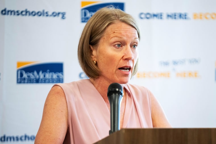 Jackie Norris speaking at a podium.