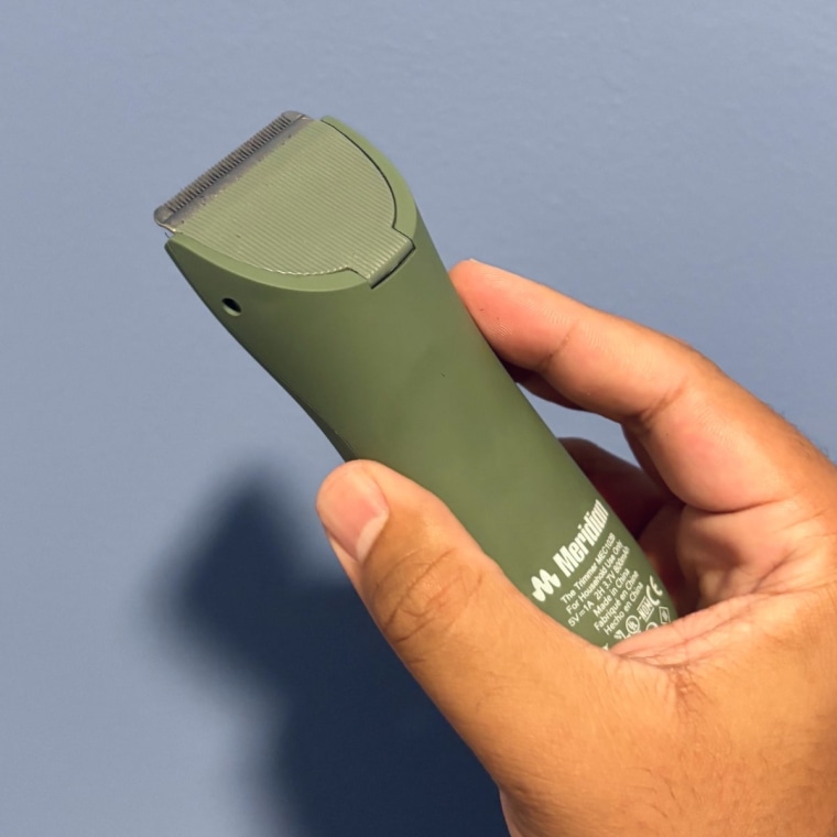 Person holding the sage Meridian The Trimmer Original.