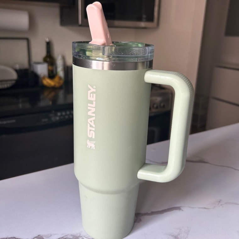 Green Stanley Quencher ProTour Flip Straw Tumbler on kitchen counter