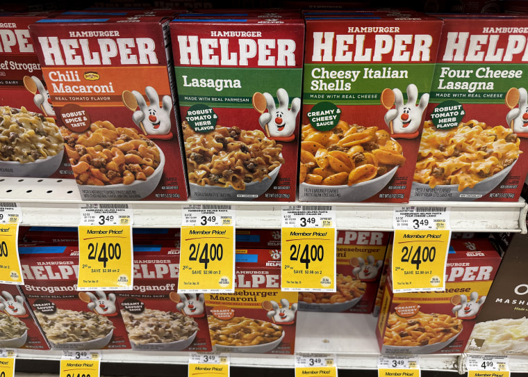 Packages of Hamburger Helper are displayed on a grocery store.