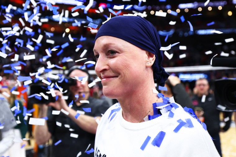Head Coach Katie Schumacher-Cawley of the Penn St. Nittany Lions celebrates after defeating the Louisville Cardinals to win the Division I Women's Volleyball Championship.