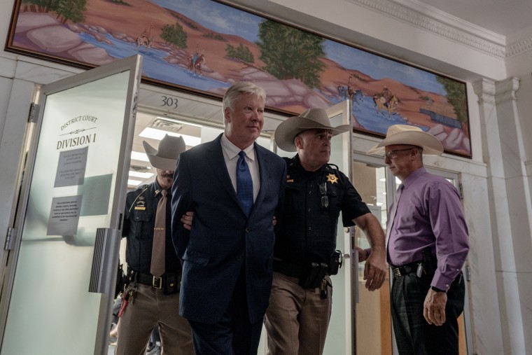 Robert Morris leaves Osage County District Court handcuffed after pleading guilty. on Oct. 2, 2025.