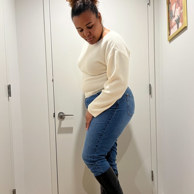 Associate editor Kamari Stewart wearing the Amazon Essentials Mid-Rise Straight Leg Jean.