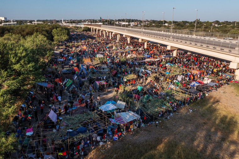 Migrants shelter near a bridge in Del Rio, Texas, on Sept. 19, 2021. 