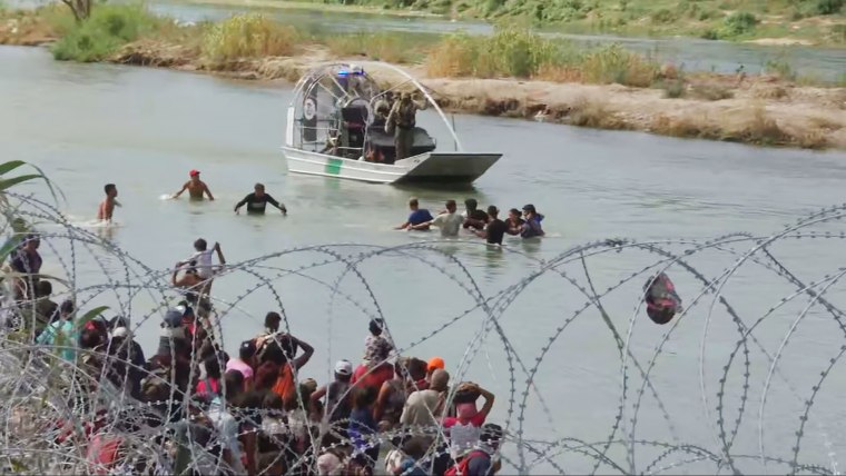 Migrants attempt to cross the Rio Grande River into Eagle Pass, Texas in September 2023. 