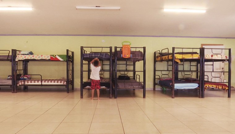 A migrant child plays inside a mostly empty migrant shelter in Reynosa, Mexico.