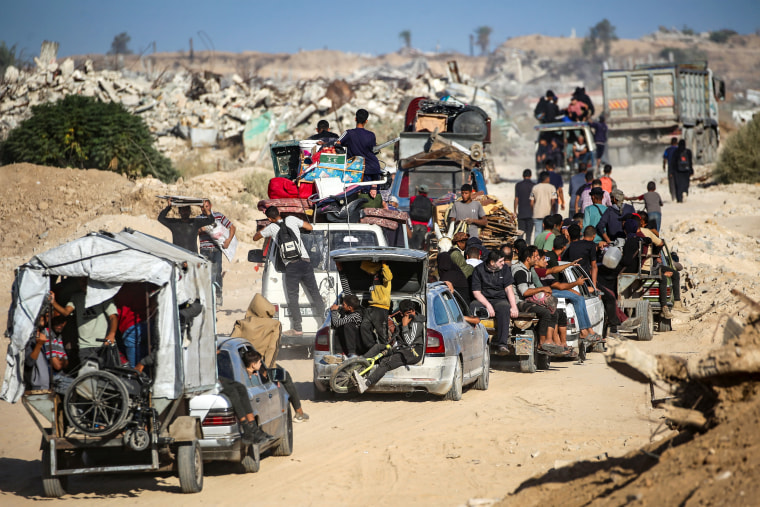 Palestinians make their way to Gaza City through the so-called Netzarim corridor from Nuseirat in the central Gaza Strip on Oct. 11.