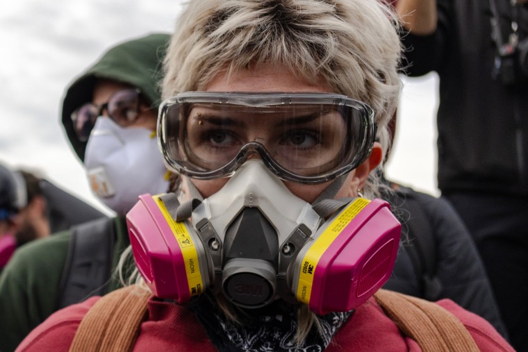 Law enforcement officers have deployed tear gas and pepper balls in skirmishes with protesters.