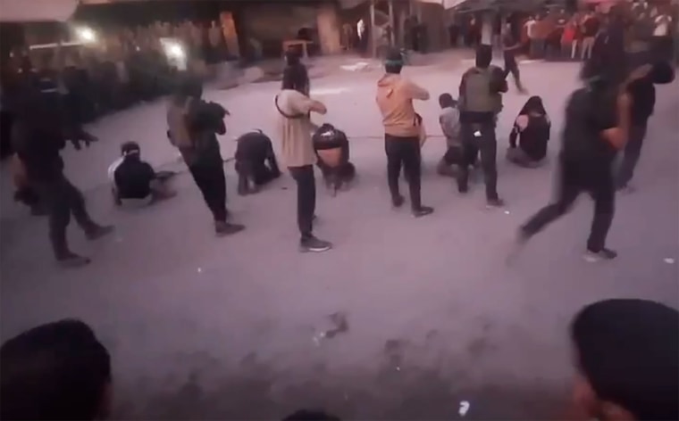 Masked gunmen prepare to execute a group of men in Gaza City.