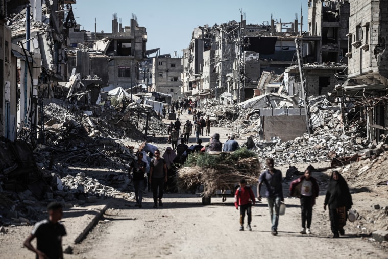 Palestinians return to devastated homes in Gaza's al-Zahra Neighborhood after Israeli withdrawal