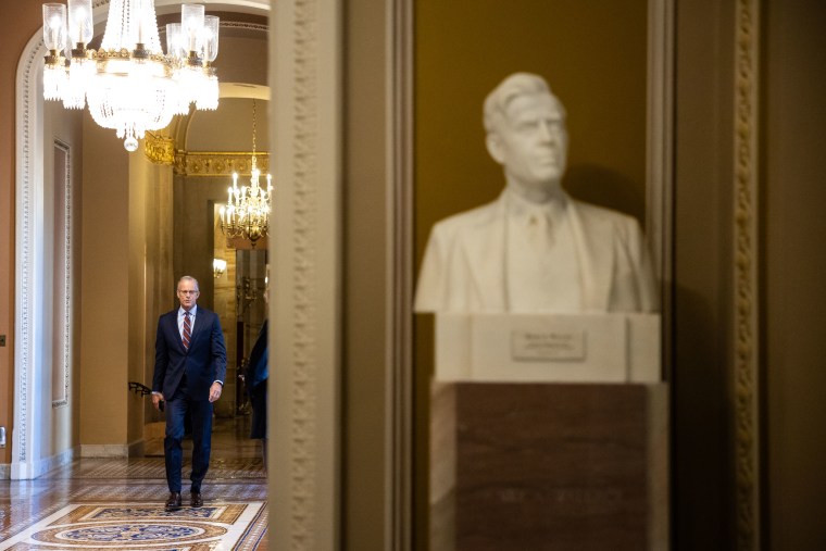 Senate Majority Leader John Thune walks to a vote at the Capitol on Oct. 9, the ninth day of a government shutdown.