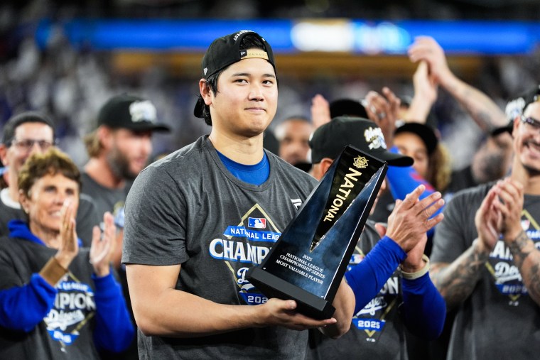 Shohei Ohtani holds a trophy