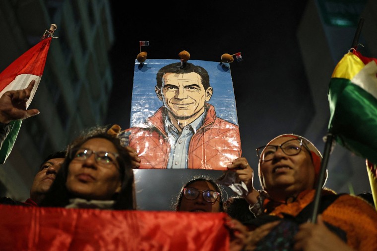 Supporters of Bolivia's presidential candidate for the Christian Democratic Party (PDC), Rodrigo Paz, celebrate after learning the results of the run-off presidential election in La Paz, on October 19, 2025.