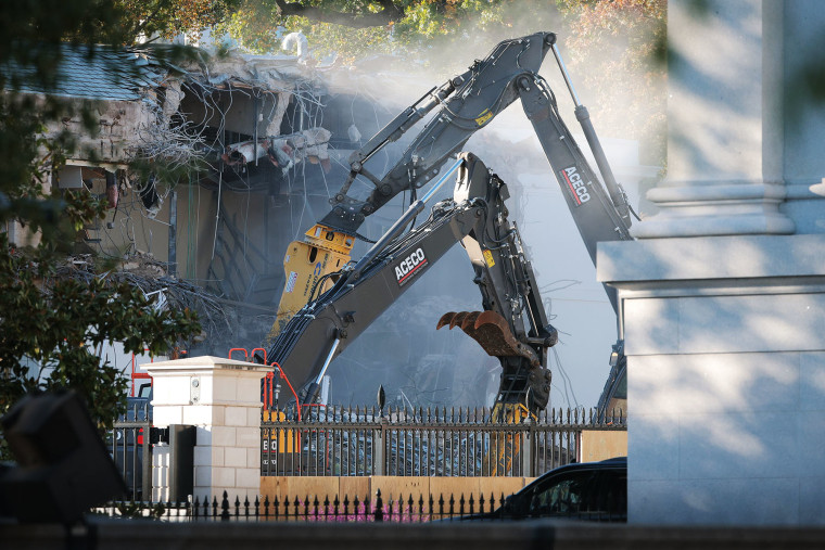 Workers demolish the facade of the East Wing of the White House on Oct. 20, 202.
