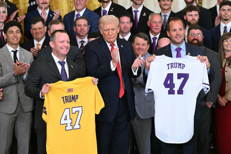 President Donald Trump poses with Louisiana State University  coach Jay Johnson, left, and LSU Shreveport coach Brad Neffendorf during a celebration for the baseball teams at the White House on Oct. 20, 2025.