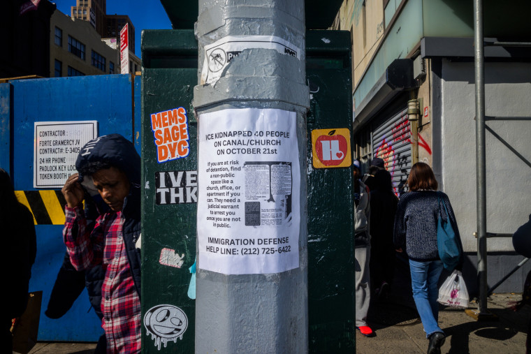 A letter on a pole outside reads "ICE kidnapped 40 people on Canal/Church on October 21st"