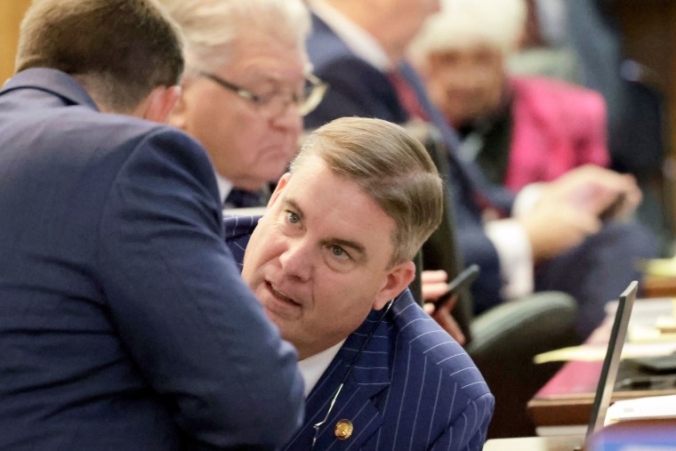 Rep. Brenden Jones, R-Columbus, confers with another lawmaker during a redistricting bill debate at the Legislative Building, Wednesday, Oct. 22, 2025, in Raleigh, N.C.