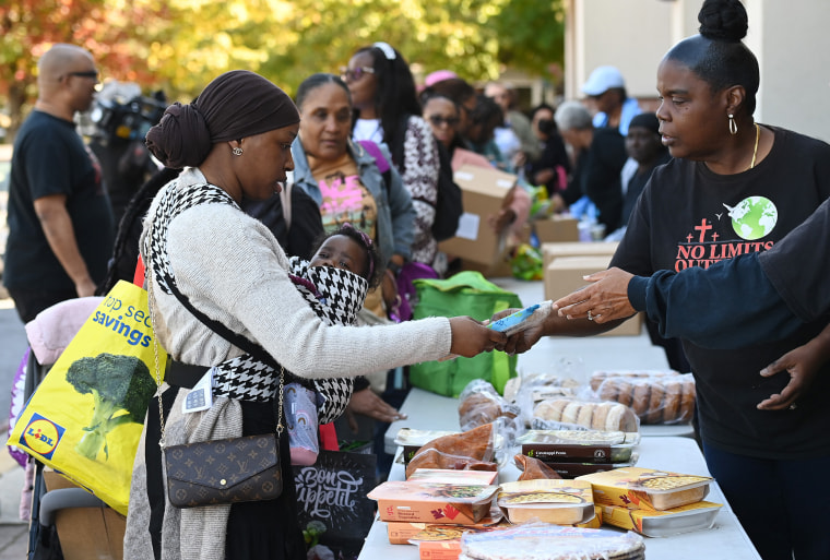 Federal employees and contractors receive food items during a free food distribution in Hyattsville, Maryland, the United States, on Oct. 21, 2025.