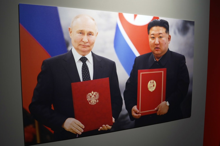 Vladimir Putin and Kim Jong Un.