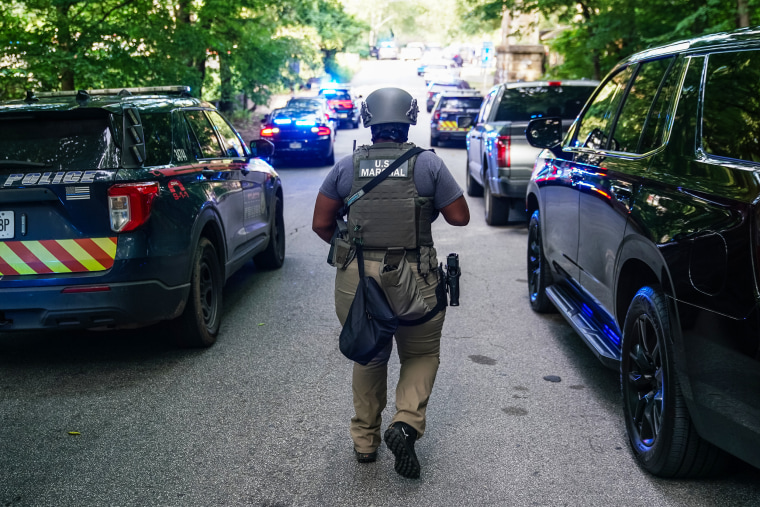 A U.S Marshal near the Centers For Disease Control (CDC) Global Headquarters during an active shooter incident in Atlanta, GA.