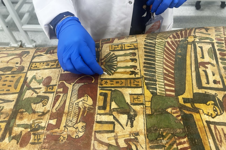 Restoration work in the Conservation Center of the Grand Egyptian Museum.