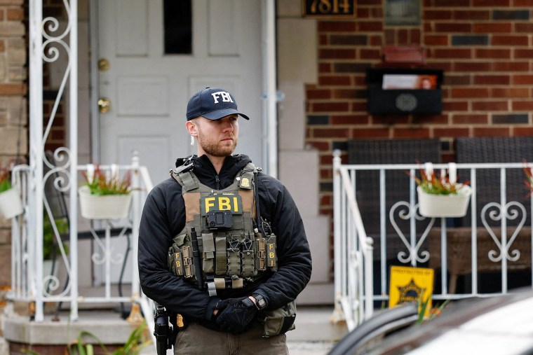 A member of the FBI Joint Terrorism Task Force stands watch 