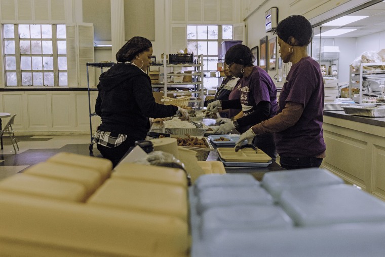 Volunteers at Stewpot prep lunch everyday for those needing food.