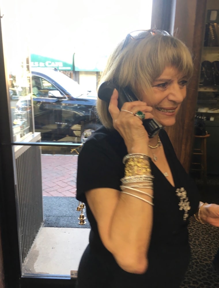 Woman smiling and speaking on the phone