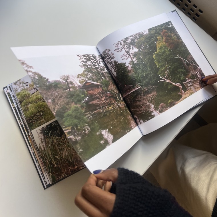 Woman flipping through a Mixbook photo book