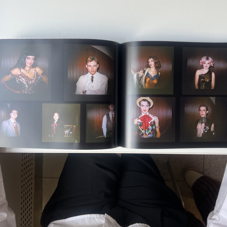 Woman flipping through Printique photo book