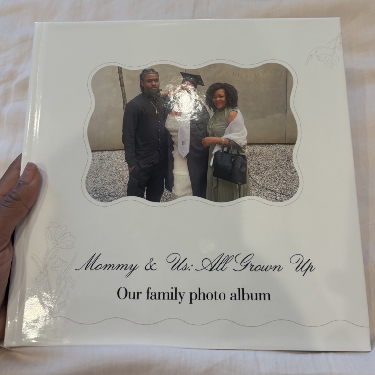Woman holding family photo album