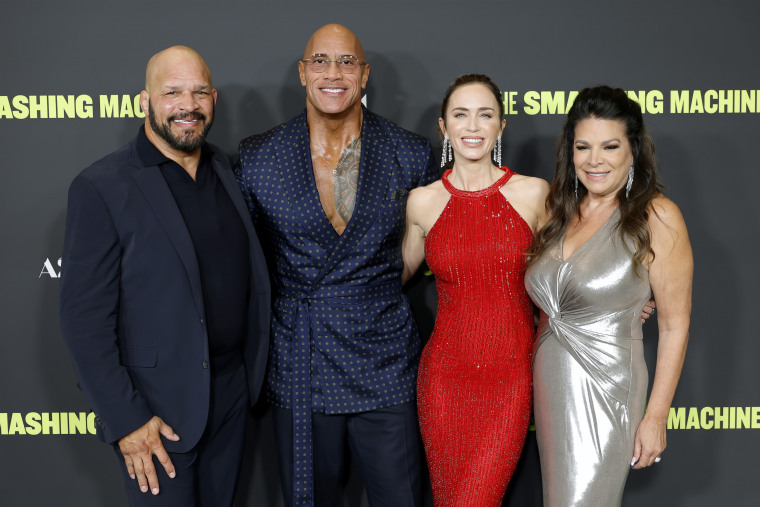 Mark Kerr, Dwayne Johnson, Emily Blunt and Don Steap Cherreus attend the premiere of Los Angeles "Smashing Machine" At the Samuel Goldvin Theater on September 29, 2025.
