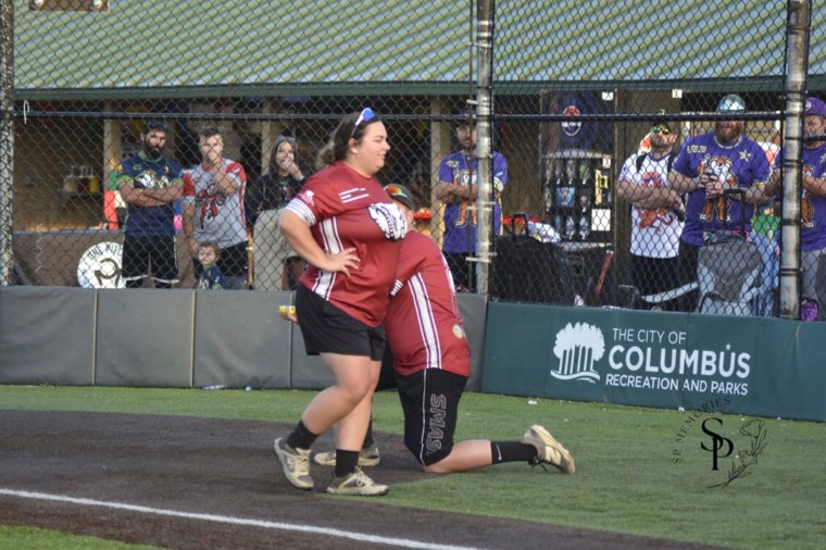Nicole Colley walked past her own proposal during a softball game.