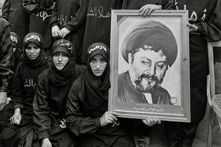 Shiite women hold a portrait of Moussa Al-Sadr at a rally in Lebanon in 1986.