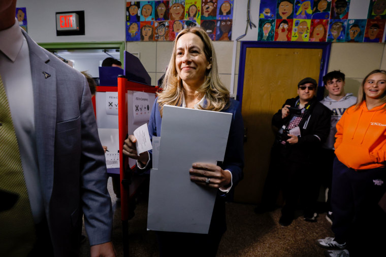 Residents Cast Ballots In New Jersey GRep. Mikie Sherrill, Democratic gubernatorial candidate for New Jersey, carries her ballot at a polling location inside Hillside Elementary School in Montclair, on Nov. 4, 2025.ubernatorial Election