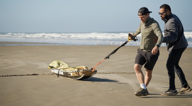 Colin O'Brady trains with a weighted sled. 