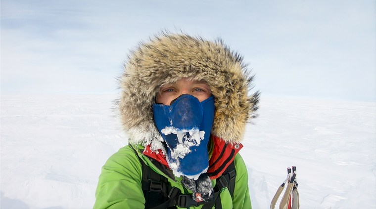 A selfie of Colin O'Brady during his 2018 expedition in Antartica. He is wearing several layers of clothing and a face mask that is covered in ice.