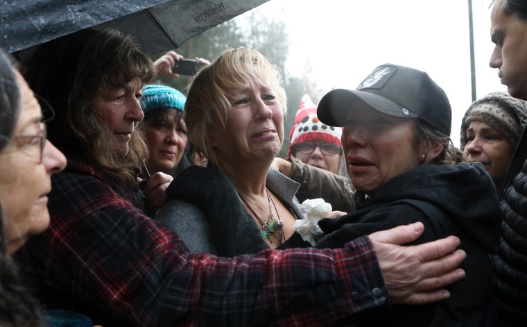 Karen Espersen is embraced by supporters and her daughter, Katie Pasitney, on Nov. 6, 2025 at the farm in Edgewood, B.C.