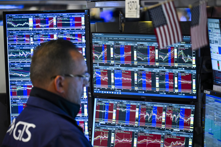 A trader works on the floor of the New York Stock Exchange.