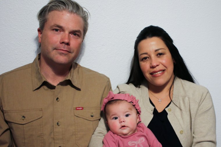 Stephen and Yurany Dexter hold their 4-month-old daughter, who was recently hospitalized for botulism, at their home in Flagstaff, Ariz. on Wednesday, Nov. 12, 2025. 
