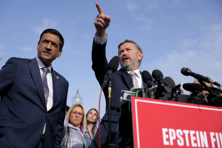 Rep. Thomas Massie, R-Ky., gestures as Rep. Ro Khanna, D-Calif., looks on during a news conference 